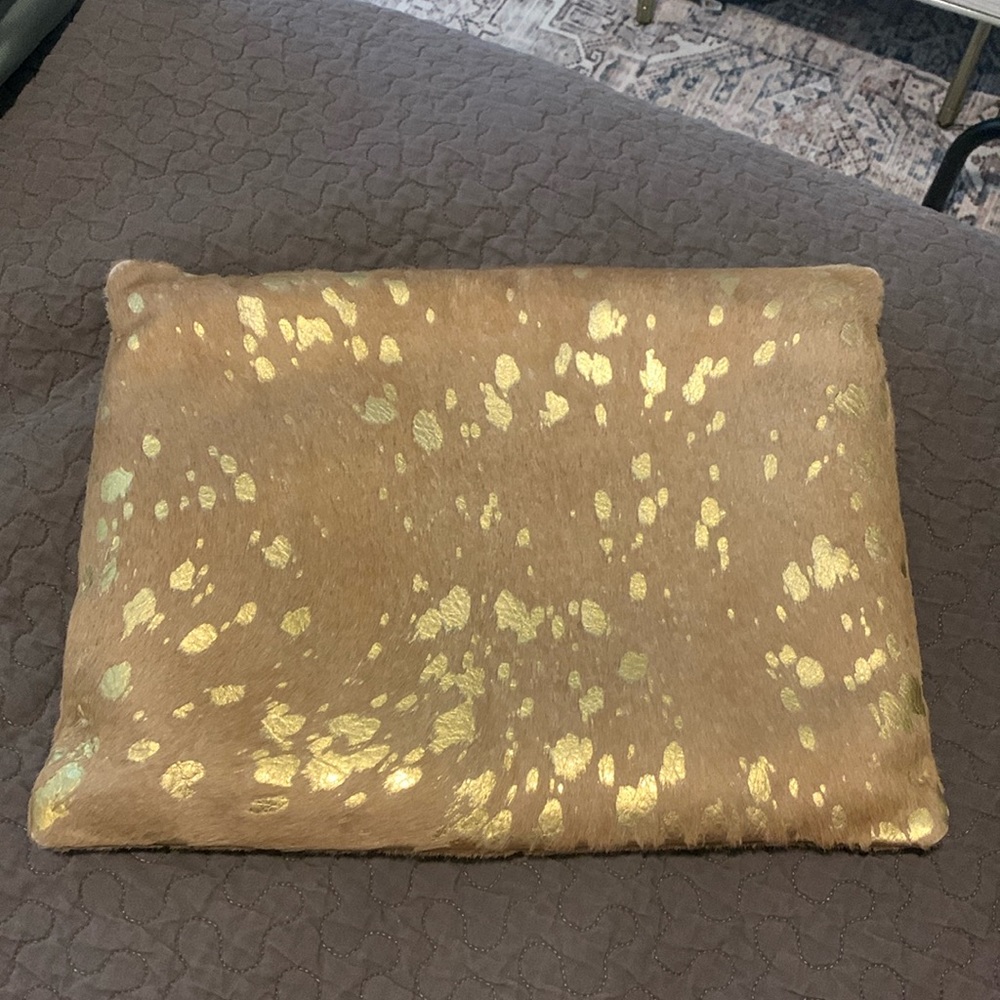 Williams Sonoma home throw pillow. Cowhide with gold sparkles